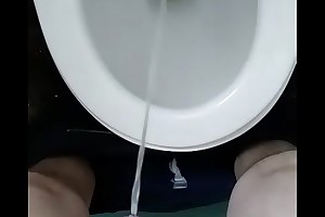 person pissing in the matter of loo